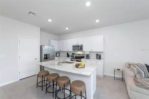 Kitchen - 17645 Crescent Moon Loop, Bradenton, FL 34211 photo 3 of 7