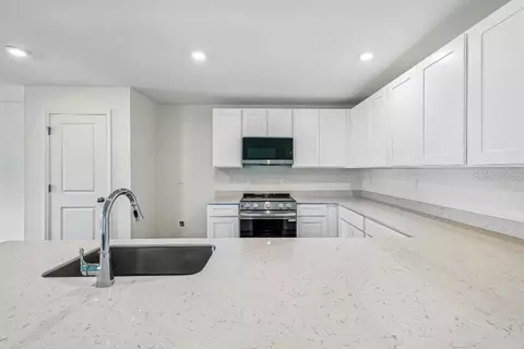 Kitchen - 831 Lamar St E, Lehigh Acres, FL 33974 photo 1 of 2
