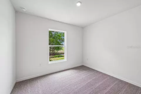 Bedroom - 831 Lamar St E, Lehigh Acres, FL 33974 photo 2 of 5