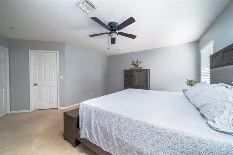 Bedroom - 5041 Pine Needle Dr, Mascotte, FL 34753 photo 6 of 7