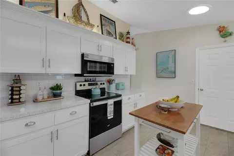 Kitchen - 10608 SE 174th Loop, Summerfield, FL 34491 photo 5 of 7