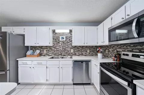Kitchen - 9820 SW 89th Ter #E, Ocala, FL 34481 photo 4 of 7