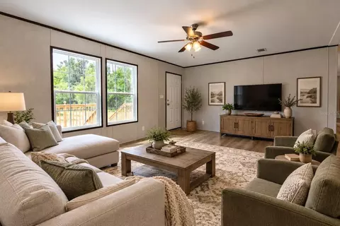Living - 419 Lily Trl, Interlachen, FL 32148 photo 4 of 5