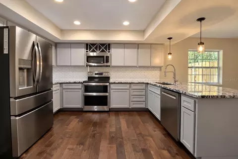 Kitchen - 612 NW 101st St, Gainesville, FL 32607 photo 1 of 7