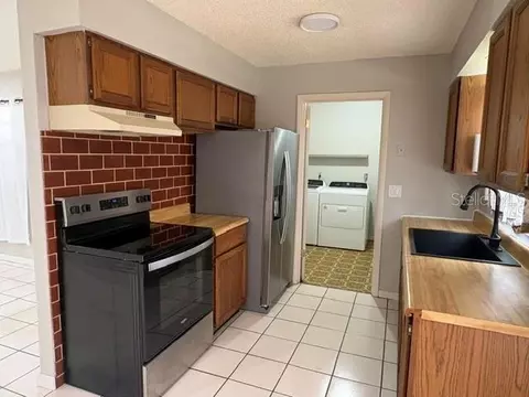 Kitchen - 506 W 9th St, Frostproof, FL 33843 photo 2 of 4