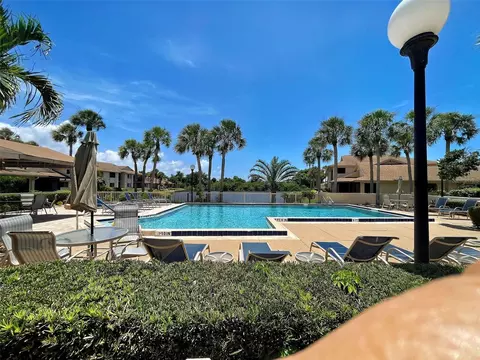 Exterior - 2004 Longpointe Cir #E2, Venice, FL 34293 photo 10 of 13