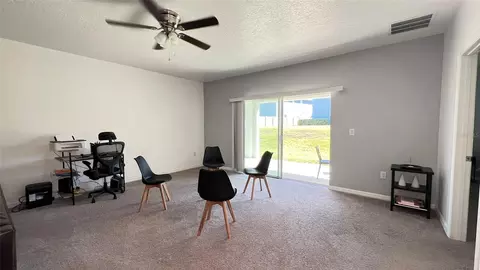 Living - 136 Hamlet Loop, Davenport, FL 33837 photo 1 of 1