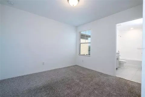 Bedroom - 4549 Burrowing Owl Loop, Saint Cloud, FL 34772 photo 6 of 10
