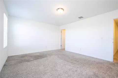 Bedroom - 4549 Burrowing Owl Loop, Saint Cloud, FL 34772 photo 8 of 10