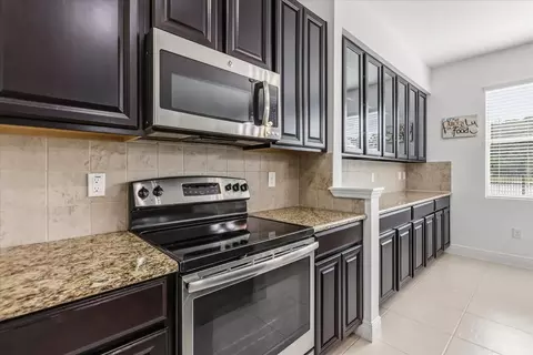 Kitchen - 10536 Cabbage Tree Loop, Orlando, FL 32825 photo 2 of 2