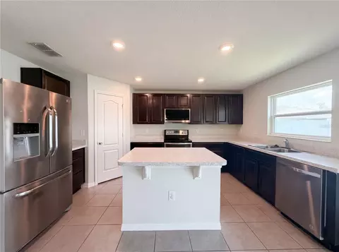 Kitchen - 4272 Moon Shadow Loop, Mulberry, FL 33860 photo 3 of 3