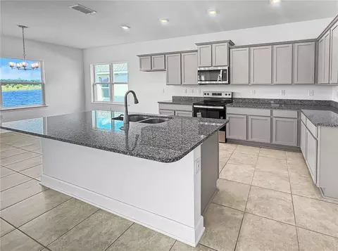 Kitchen - 7575 Bent Tree Loop, Harmony, FL 34773 photo 1 of 3