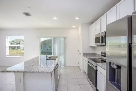 Kitchen - 8099 SW 9th Ln, Gainesville, FL 32608 photo 2 of 3
