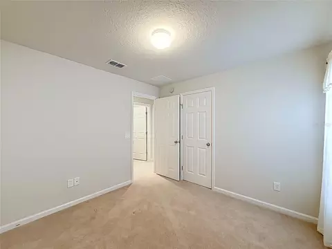 Bedroom - 5669 SW 40th St, Ocala, FL 34474 photo 3 of 16
