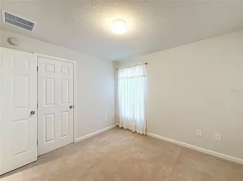 Bedroom - 5669 SW 40th St, Ocala, FL 34474 photo 2 of 16