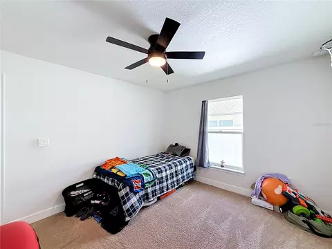 Bedroom - 5108 SW 90th Pl, Ocala, FL 34476 photo 2 of 11