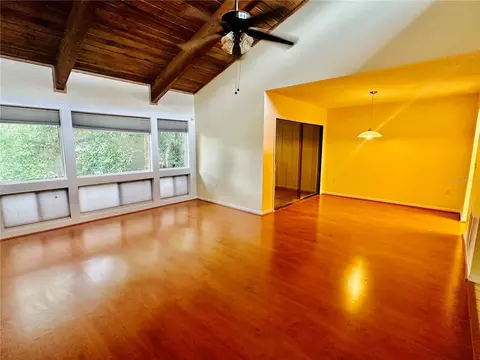 Living - 6057 Windhover Dr #E-08, Orlando, FL 32819 photo 2 of 4