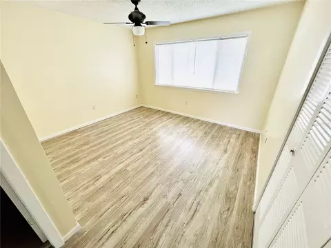 Bedroom - 6057 Windhover Dr #E-08, Orlando, FL 32819 photo 2 of 5