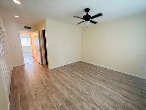 Bedroom - 6057 Windhover Dr #E-08, Orlando, FL 32819 photo 3 of 5
