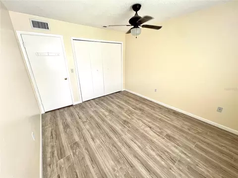 Bedroom - 6057 Windhover Dr #E-08, Orlando, FL 32819 photo 5 of 5
