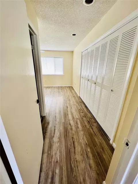 Entry Way - 6057 Windhover Dr #E-08, Orlando, FL 32819 photo 1 of 2