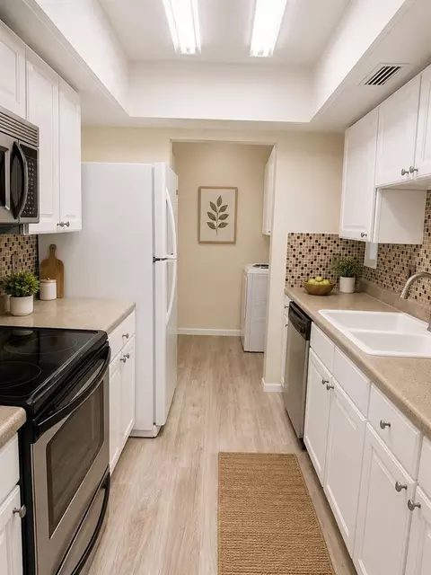 Kitchen - 6057 Windhover Dr #E-08, Orlando, FL 32819 photo 1 of 2