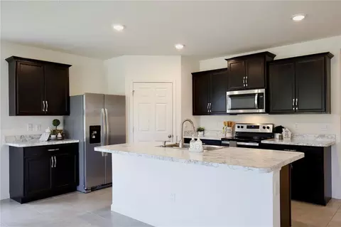 Kitchen - 3020 Burrowing Owl Dr, Mims, FL 32754 photo 3 of 4