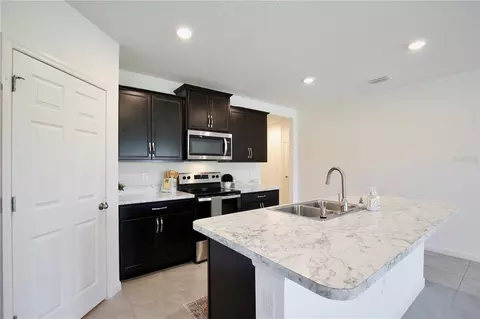 Kitchen - 3020 Burrowing Owl Dr, Mims, FL 32754 photo 4 of 4