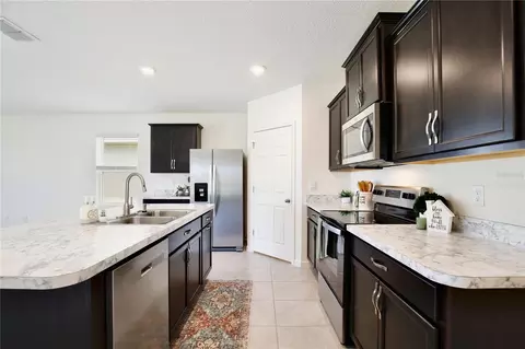 Kitchen - 3020 Burrowing Owl Dr, Mims, FL 32754 photo 2 of 4