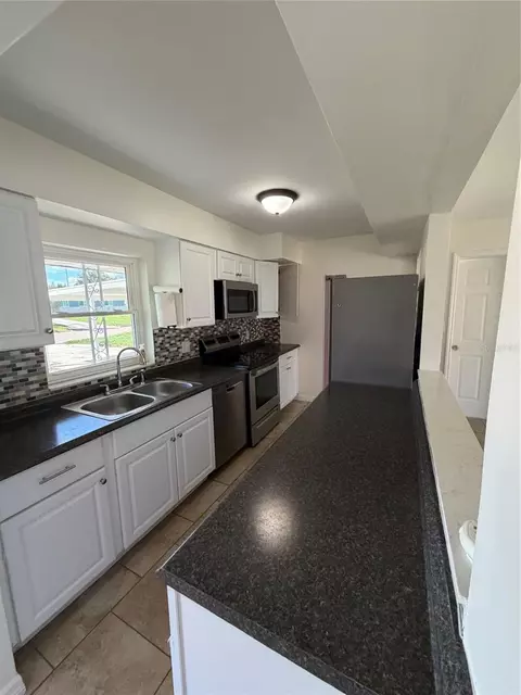 Kitchen - 303 Windemere Ave, Eustis, FL 32726 photo 2 of 3