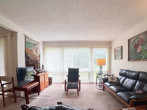 Living - 5885 Windhover Dr #4E, Orlando, FL 32819 photo 2 of 3