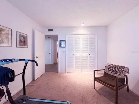 Bedroom - 5885 Windhover Dr #4E, Orlando, FL 32819 photo 3 of 6