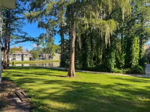 Exterior - 5885 Windhover Dr #4E, Orlando, FL 32819 photo 7 of 11