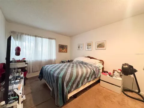 Bedroom - 5885 Windhover Dr #4E, Orlando, FL 32819 photo 1 of 6