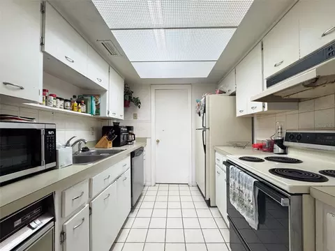 Kitchen - 5885 Windhover Dr #4E, Orlando, FL 32819 photo 1 of 3