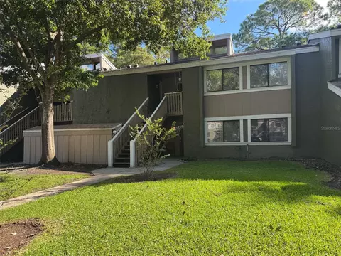 Exterior - 5885 Windhover Dr #4E, Orlando, FL 32819 photo 2 of 11