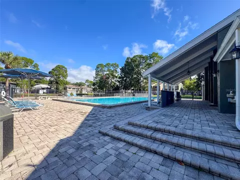 Exterior - 5885 Windhover Dr #4E, Orlando, FL 32819 photo 9 of 11