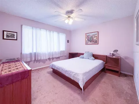 Bedroom - 5885 Windhover Dr #4E, Orlando, FL 32819 photo 5 of 6