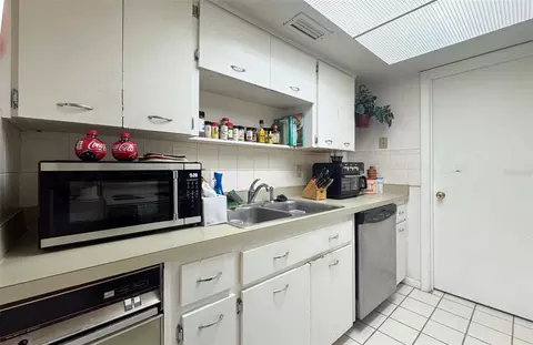 Kitchen - 5885 Windhover Dr #4E, Orlando, FL 32819 photo 2 of 3