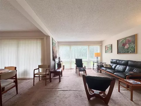 Living - 5885 Windhover Dr #4E, Orlando, FL 32819 photo 1 of 3
