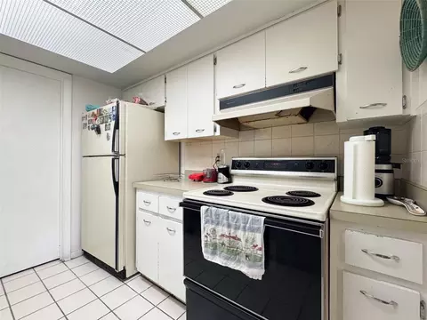 Kitchen - 5885 Windhover Dr #4E, Orlando, FL 32819 photo 3 of 3
