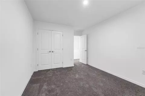 Bedroom - 1678 Meadowgrove Ave NE, Saint Cloud, FL 34771 photo 5 of 9