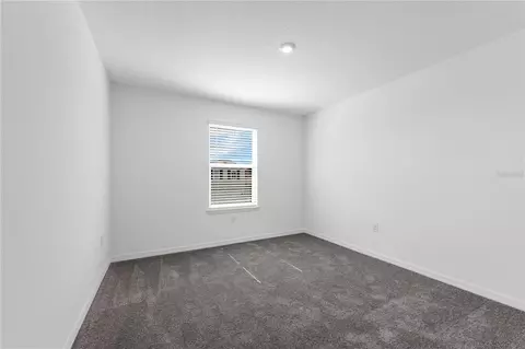 Bedroom - 1678 Meadowgrove Ave NE, Saint Cloud, FL 34771 photo 8 of 9