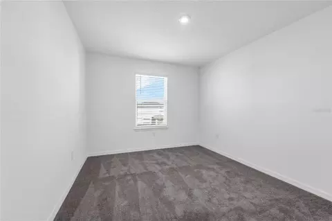 Bedroom - 1678 Meadowgrove Ave NE, Saint Cloud, FL 34771 photo 4 of 9