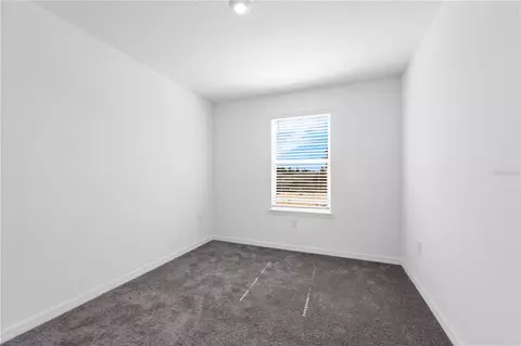 Bedroom - 1678 Meadowgrove Ave NE, Saint Cloud, FL 34771 photo 6 of 9