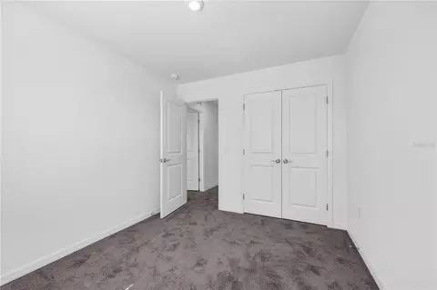 Bedroom - 1678 Meadowgrove Ave NE, Saint Cloud, FL 34771 photo 7 of 9