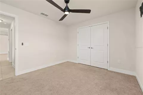 Bedroom - 702 Country Walk Cv, Eagle Lake, FL 33839 photo 9 of 10