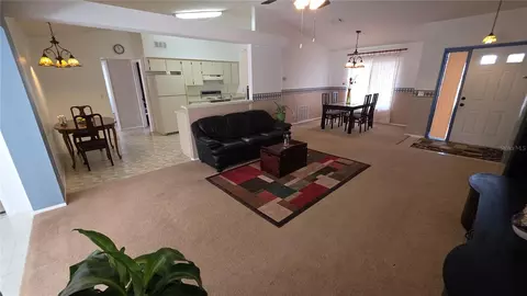 Living - 7514 Herricks Loop, Orlando, FL 32835 photo 2 of 3