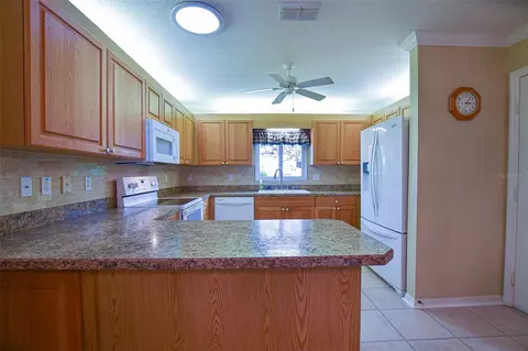 Kitchen - 9033 SE 135th Loop, Summerfield, FL 34491 photo 2 of 6