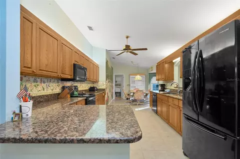 Kitchen - 9921 SE 138th Loop, Summerfield, FL 34491 photo 2 of 4